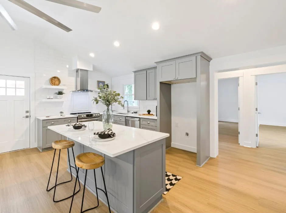 Open-concept kitchen remodel with custom cabinets and quartz island completed by One Stop Construction in Southern Utah
